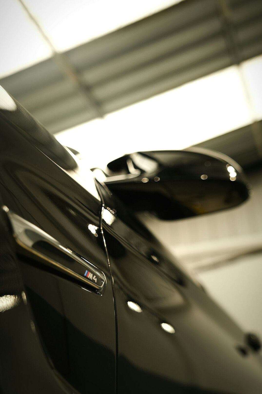 Black car with mirror finish after full paint correction