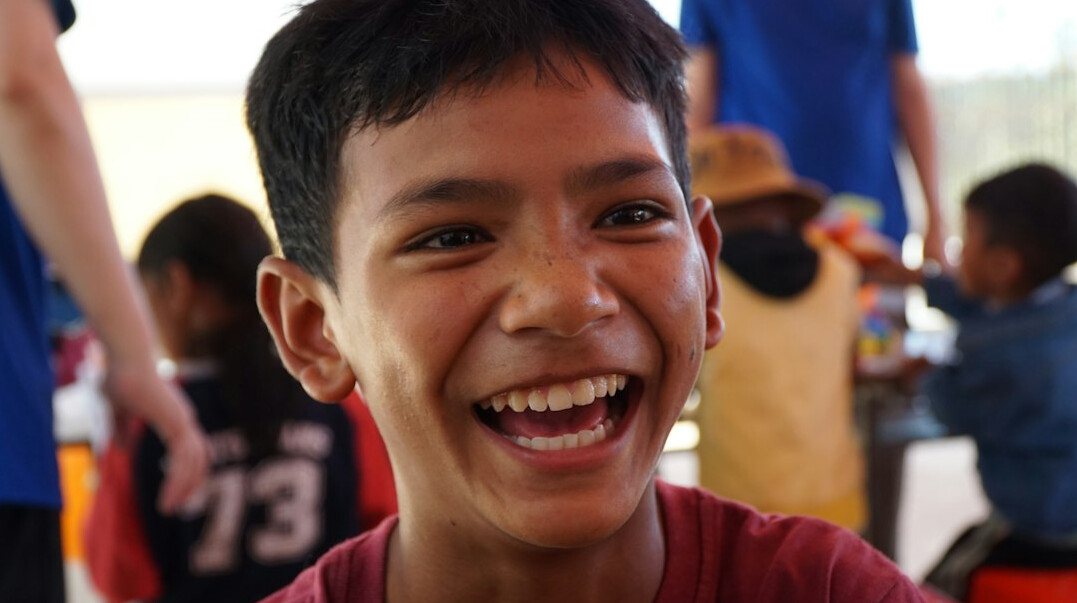 Portrait of a smiling man with short dark hair